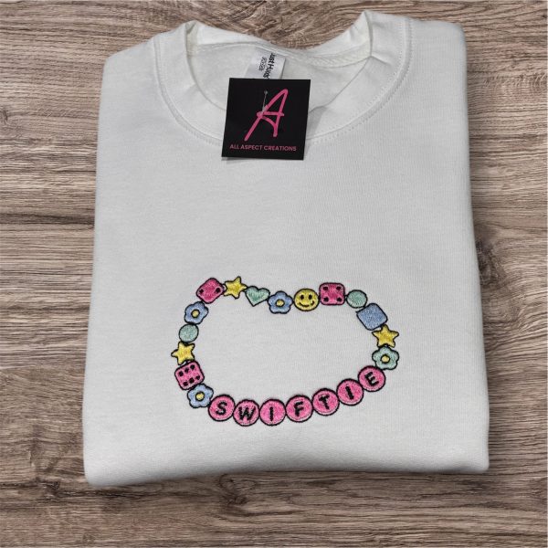 Swiftie bracelet, embroidered children’s sweatshirt.