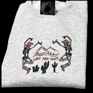 Embroidered dancing skeletons in cowboy boots, sweatshirt or hoodie. Country clothing, cowboy gifts, westernwear.