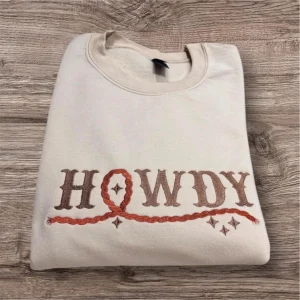 Embroidered Howdy rope, sweatshirt or hoodie. Country clothing, cowboy hat, western vibes.