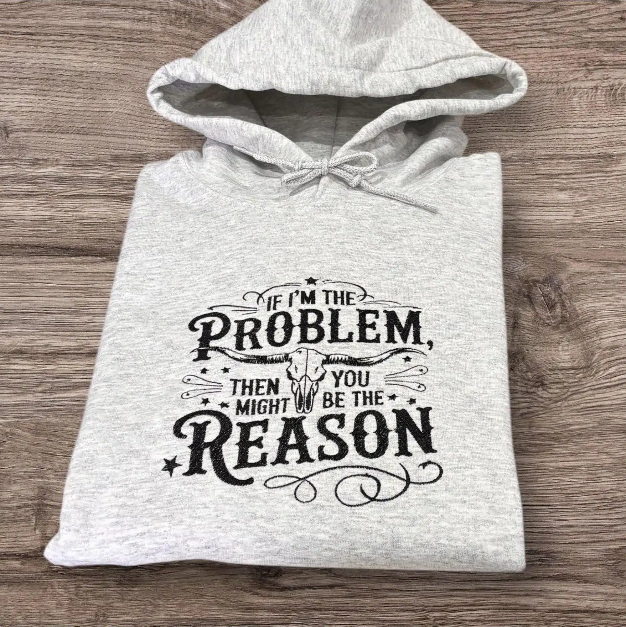 Embroidered longhorn, if I’m the problem slogan sweatshirt or hoodie.