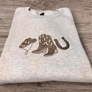 Embroidered cowboy boots, cowboy hat,horse shoe sweatshirt or hoodie. Country clothing, cowgirl, western vibes.