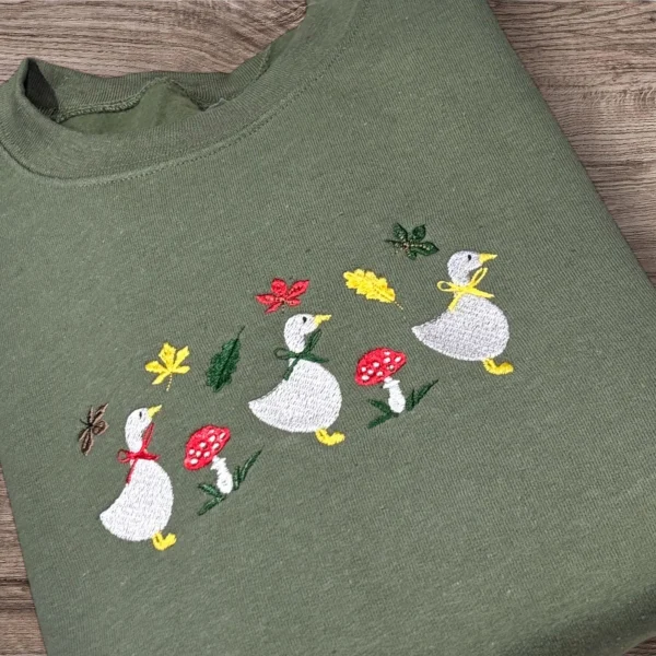 Embroidered row of geese, autumn leaves, mushroom sweatshirt or hoodie. - Image 2
