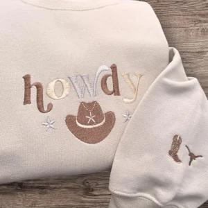 Embroidered Howdy with a cowboy hat, sweatshirt or hoodie. Country clothing, cowgirl, western vibes.