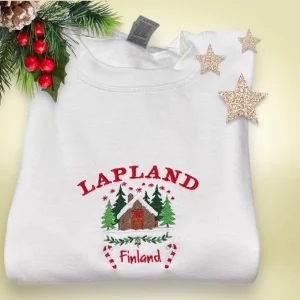 Embroidered Lapland Christmas Sweatshirt: Festive Log Cabin Design