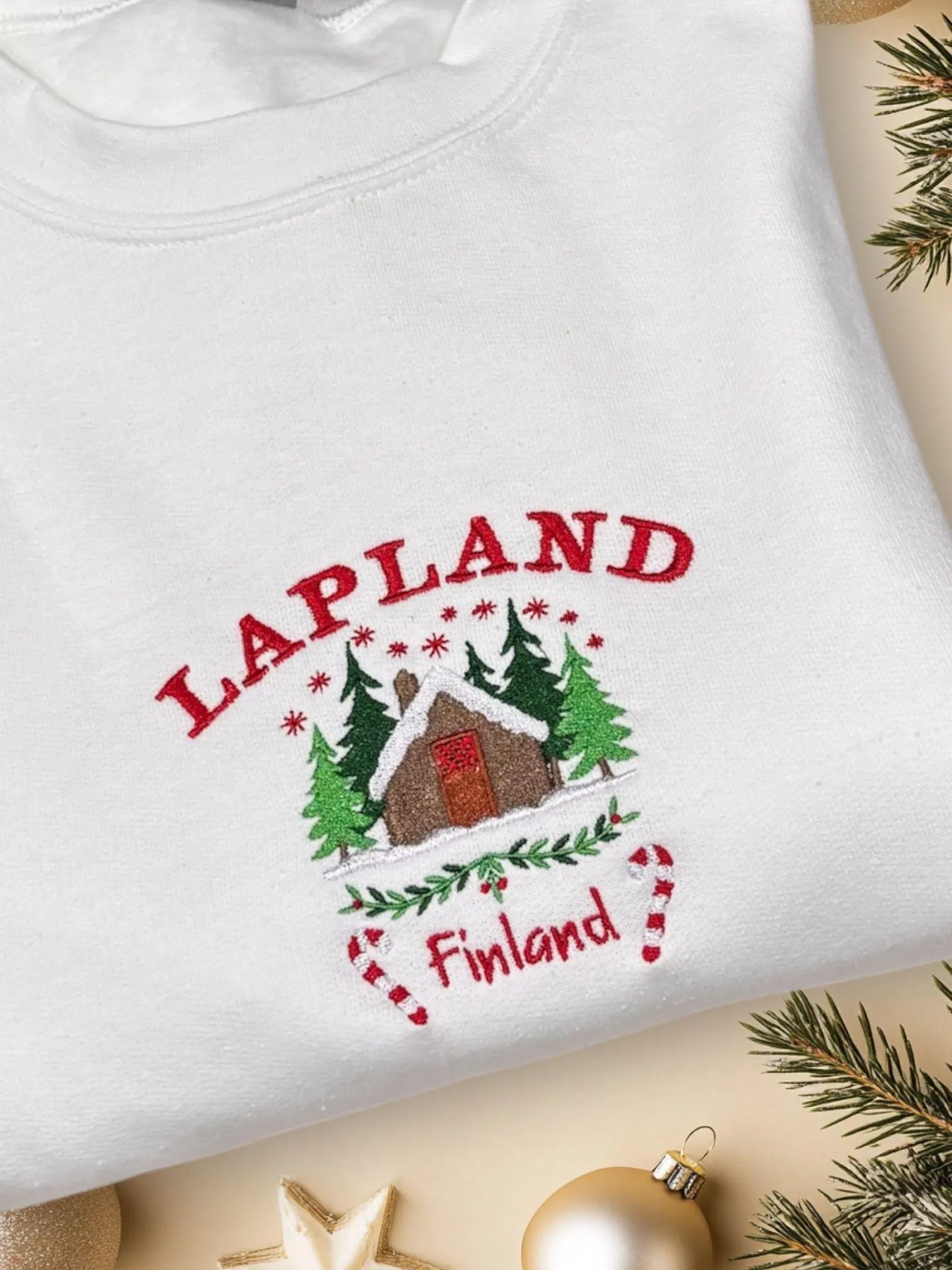 Embroidered Lapland Christmas Sweatshirt: Festive Log Cabin Design - Image 3