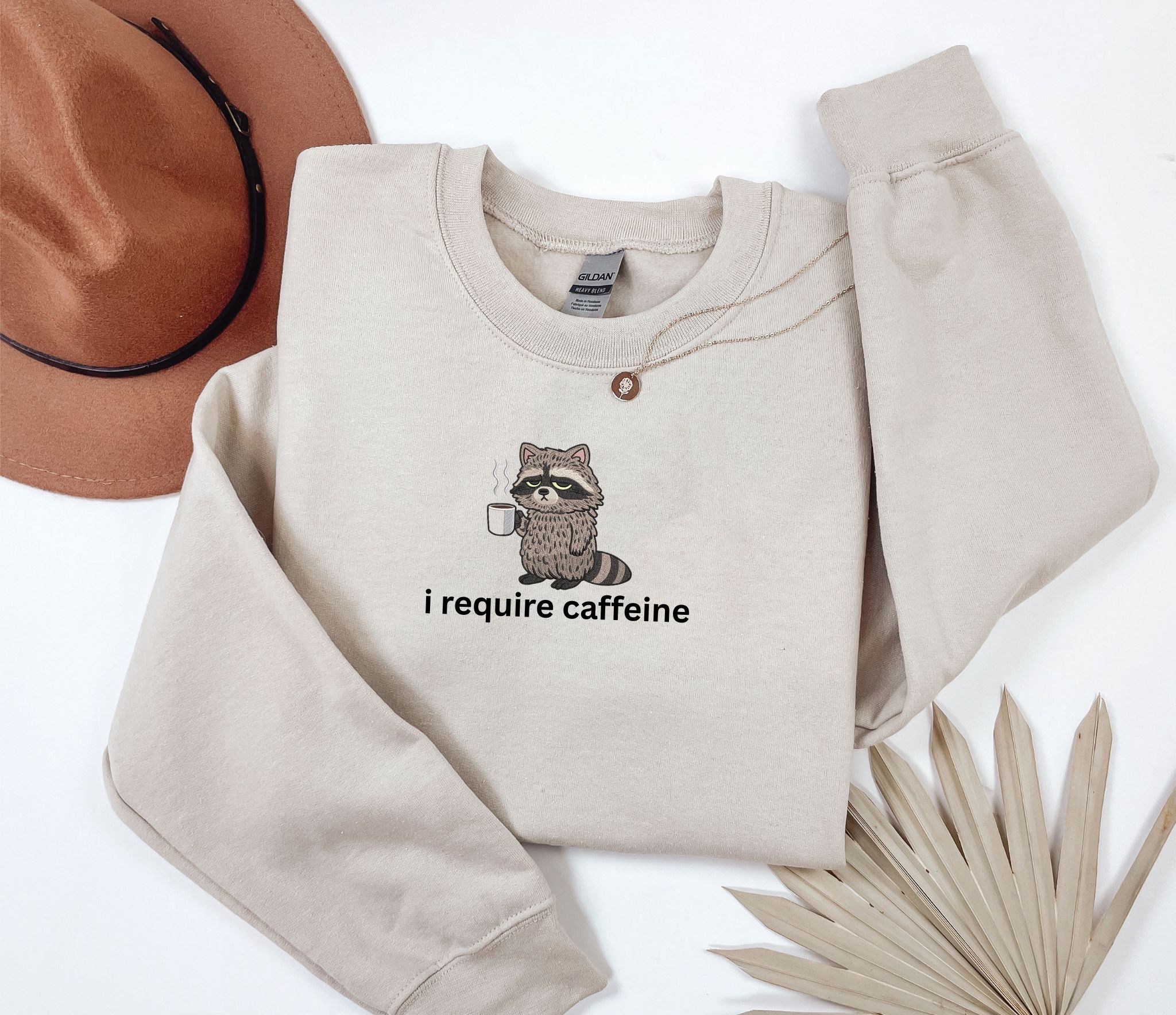 Embroidered i require caffeine raccoon sweatshirt