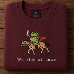 Embroidered we ride at dawn frog on a horse sweatshirt
